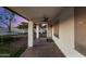 Covered patio with string lights, ceiling fan, and views of the landscaped backyard with a trampoline at 2646 N Robin Ln, Mesa, AZ 85213