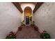 Inviting entryway with brick flooring, potted plants, and a blue front door at 2646 N Robin Ln, Mesa, AZ 85213