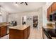 Well-lit kitchen features granite countertops, modern appliances, and tile flooring at 2646 N Robin Ln, Mesa, AZ 85213