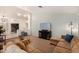 Cozy living room featuring plush couches, a TV, and neutral carpeting at 2646 N Robin Ln, Mesa, AZ 85213