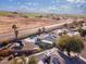 Aerial view of home featuring desert landscaping and a pool in a rural area at 26649 S Howard Dr, Sun Lakes, AZ 85248