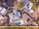 Aerial view of a house with a pool, solar panels and desert landscaping at 26649 S Howard Dr, Sun Lakes, AZ 85248