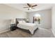 Bedroom featuring a ceiling fan, gray carpet, and a window with a view to the front yard at 26649 S Howard Dr, Sun Lakes, AZ 85248