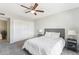 Bedroom featuring a ceiling fan, gray carpet, and a large closet at 26649 S Howard Dr, Sun Lakes, AZ 85248