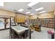 Library features a fireplace, cozy seating, and extensive book collection for residents at 26649 S Howard Dr, Sun Lakes, AZ 85248