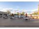 Lounge area with tables and chairs next to sparkling blue swimming pool ready for relaxation at 26649 S Howard Dr, Sun Lakes, AZ 85248