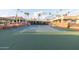 This outdoor tennis court is surrounded by beautiful landscaping and well-maintained facilities at 26649 S Howard Dr, Sun Lakes, AZ 85248