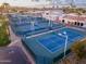 Aerial view of the tennis courts with professional lighting, nestled in a premier community at 26649 S Howard Dr, Sun Lakes, AZ 85248