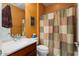 Cozy bathroom featuring a single sink vanity and a shower with patterned curtains at 27108 W Escuda Dr, Buckeye, AZ 85396