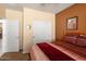 This bedroom features a closet, neutral walls, and a comfortable bed with bright, natural light at 27108 W Escuda Dr, Buckeye, AZ 85396