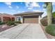 A well-maintained single-story home with a two-car garage and concrete driveway at 27108 W Escuda Dr, Buckeye, AZ 85396