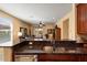 Bright kitchen with granite countertops looking to a cozy living space and outdoor patio at 27108 W Escuda Dr, Buckeye, AZ 85396