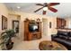 Open concept living room featuring tile floors and a seamless connection to the kitchen area at 27108 W Escuda Dr, Buckeye, AZ 85396