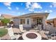 Outdoor living space featuring a paver patio, comfortable seating, and a built-in counter, ideal for relaxation and enjoyment at 27108 W Escuda Dr, Buckeye, AZ 85396