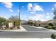 Quiet neighborhood street with well-maintained homes, desert landscaping, mountain views, and clear blue skies at 27108 W Escuda Dr, Buckeye, AZ 85396