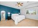 A main bedroom offers a blue accent wall, carpet flooring, and a ceiling fan at 28871 N Coal Ave, San Tan Valley, AZ 85143