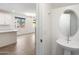 Modern powder room with stylish sink and fixtures adjacent to an open kitchen and living area at 300 N Gila Springs Blvd # 141, Chandler, AZ 85226