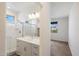 Modern bathroom featuring a glass-enclosed shower and a vanity with sleek white cabinets at 300 N Gila Springs Blvd # 141, Chandler, AZ 85226