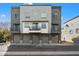 Stylish townhome showcasing garage parking, private balconies, and modern architectural details at 300 N Gila Springs Blvd # 141, Chandler, AZ 85226