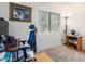 Carpeted bedroom featuring a modern blue adjustable chair, a window, and a decorative cat print at 3034 N Ricardo --, Mesa, AZ 85215