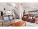 Spacious living room with vaulted ceiling, staircase, neutral color palette, and ample natural light at 3034 N Ricardo --, Mesa, AZ 85215