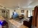 Inviting living room featuring comfortable seating, ceiling fan, and natural light for relaxation at 3034 N Ricardo --, Mesa, AZ 85215