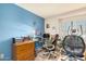 Comfortable home office with a desk, chair, window with blinds and a light blue wall at 3034 N Ricardo --, Mesa, AZ 85215