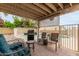 The backyard patio features comfortable seating with a grill near the pool at 3034 N Ricardo --, Mesa, AZ 85215