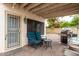 Covered patio space with outdoor seating and barbecue near the backyard pool at 3034 N Ricardo --, Mesa, AZ 85215