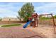 Backyard playground equipment on a well-maintained lot with trees and foliage at 3034 N Ricardo --, Mesa, AZ 85215