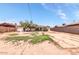 View of the property featuring a spacious backyard and a block fence at 3129 W Pierce St, Phoenix, AZ 85009