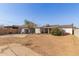 A backyard featuring a dirt ground and a shed, perfect for outdoor activities at 3129 W Pierce St, Phoenix, AZ 85009