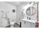 Clean bathroom featuring modern vanity, toilet, mirror, and neutral decor at 3129 W Pierce St, Phoenix, AZ 85009