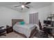 Cozy bedroom with a comfortable bed, ceiling fan, and a workspace at 3129 W Pierce St, Phoenix, AZ 85009