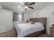 Inviting bedroom with a bed, a ceiling fan, and a bright window at 3129 W Pierce St, Phoenix, AZ 85009