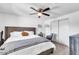 Bedroom featuring a stylish bed, closet, mirror, and chair, offering a relaxing space at 3129 W Pierce St, Phoenix, AZ 85009