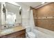 Well-lit bathroom showcasing an over-sized vanity with tub and shower combo at 3428 E Lance Ln, Phoenix, AZ 85018