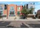 Charming townhomes with attached garages, colorful facades, and well-kept landscaping at 3428 E Lance Ln, Phoenix, AZ 85018