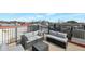 Rooftop deck with mountain views features comfortable seating, a grill, and stylish outdoor decor at 3428 E Lance Ln, Phoenix, AZ 85018