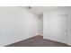 Cozy bedroom features neutral carpet, white walls, closet, and entry to hallway at 35436 N Breezy Ln, San Tan Valley, AZ 85140