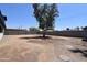 Large backyard with block fence and mature tree at 3547 W Encanto Blvd, Phoenix, AZ 85009