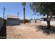 Fenced backyard featuring a storage shed, trees and perimeter wall at 3547 W Encanto Blvd, Phoenix, AZ 85009