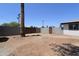 Backyard is surrounded by a wall, trees, and an exterior fence with a gate at 3547 W Encanto Blvd, Phoenix, AZ 85009