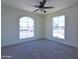 Neutral bedroom with carpet, ceiling fan, and bright natural light at 3547 W Encanto Blvd, Phoenix, AZ 85009