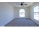 Neutral bedroom with carpet, ceiling fan, and bright natural light at 3547 W Encanto Blvd, Phoenix, AZ 85009