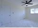 Bright bedroom featuring white tile floors, a ceiling fan, and a window at 3547 W Encanto Blvd, Phoenix, AZ 85009