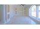 Bright living room with built-in shelves, white columns, large windows, and decorative tile flooring at 3547 W Encanto Blvd, Phoenix, AZ 85009