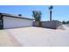 Spacious side yard with a concrete pad and brick accents providing extra parking and storage at 3547 W Encanto Blvd, Phoenix, AZ 85009