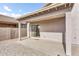 Covered backyard patio featuring brick flooring and an exit to the backyard at 36852 N Yellowstone Dr, San Tan Valley, AZ 85140