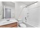 Bright bathroom showcasing a tub-shower combo, a toilet, and a wood-trimmed vanity at 36852 N Yellowstone Dr, San Tan Valley, AZ 85140